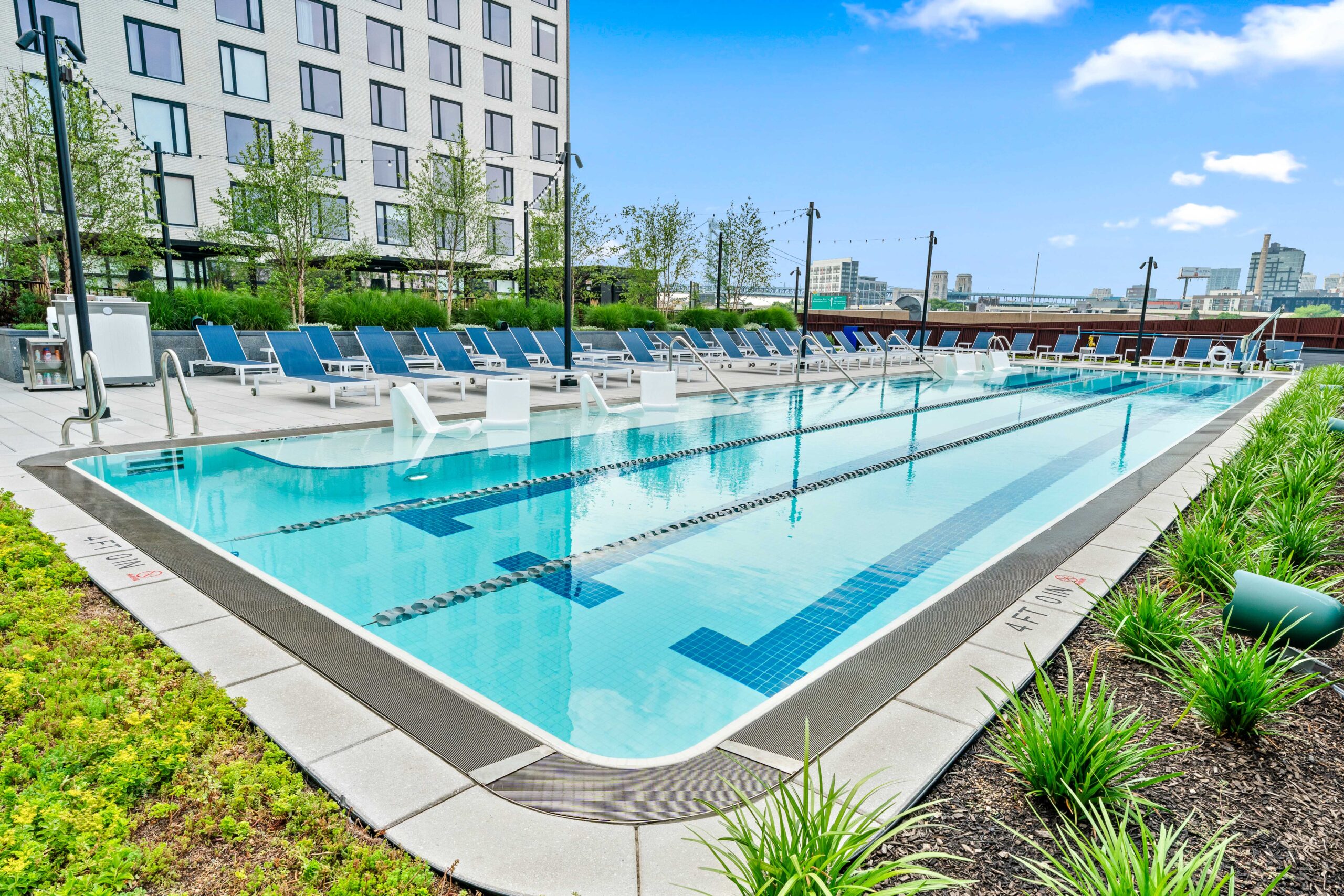 outdoor exercise pool surrounded by lounge chairs