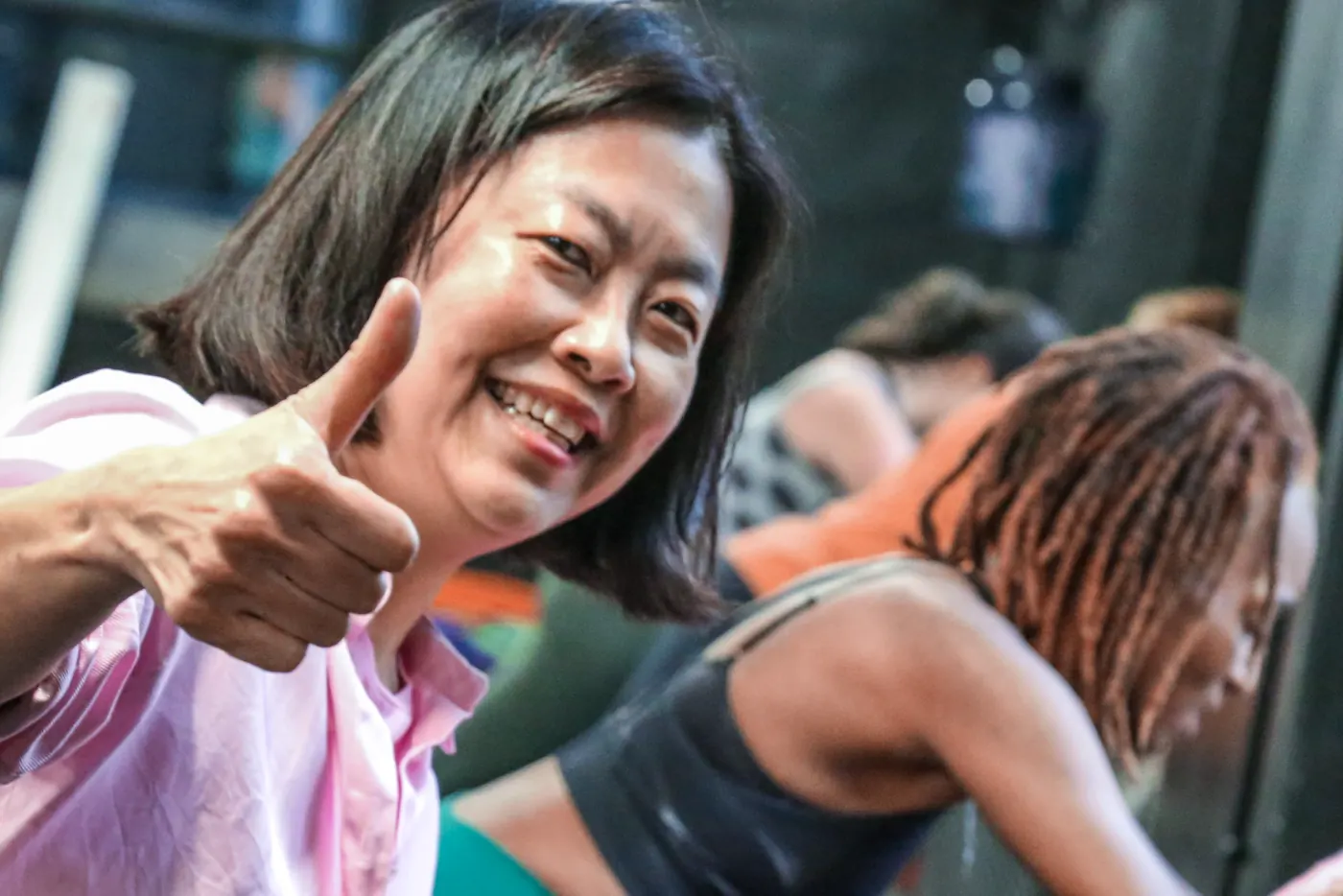 A City Fitness team member gives a thumbs up during Push for Pink 2025